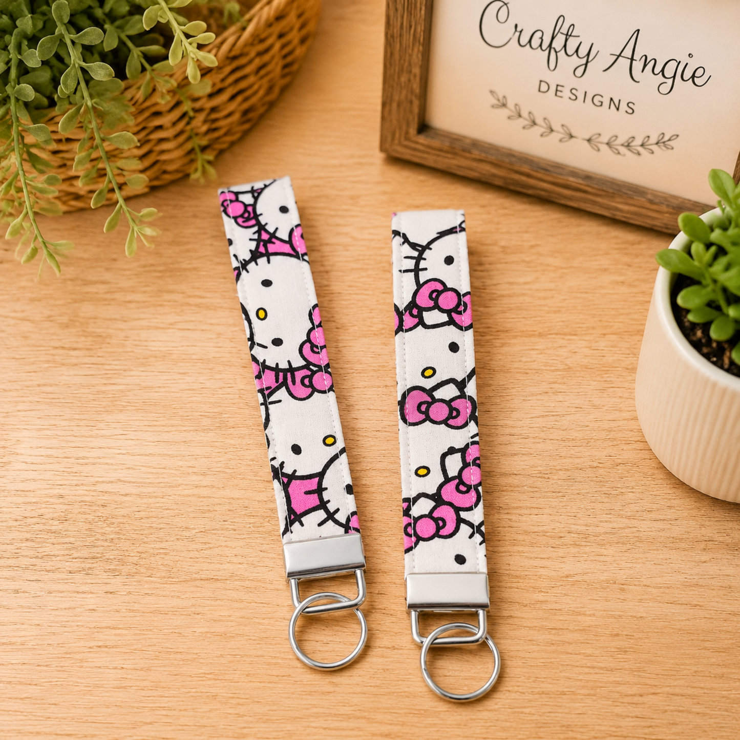 Hello Kitty Fabric Keychain Wristlet in Faces Repeat