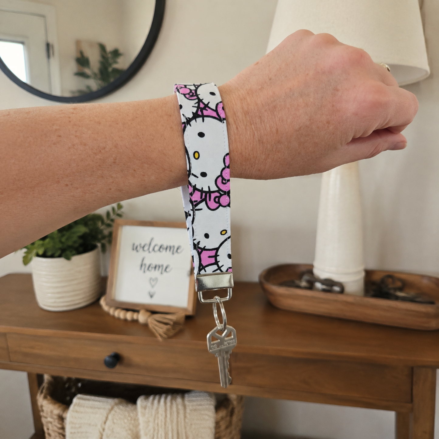 Hello Kitty Fabric Keychain Wristlet in Faces Repeat